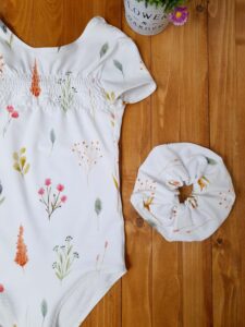 Body in cotone con riccetto  sul davanti
